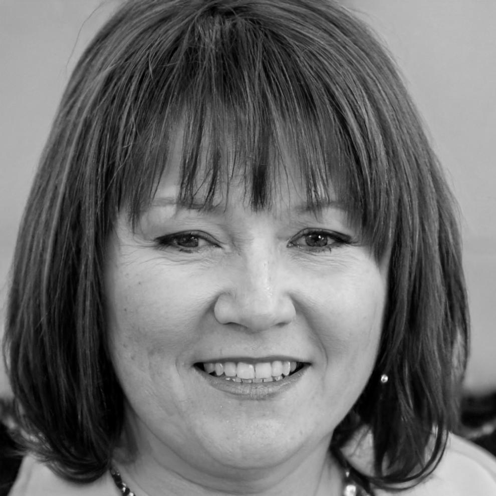 Portrait of blockchain instructor Sarah with professional headshot